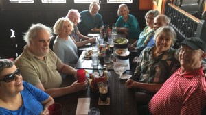 Photo of 10 people around a table.